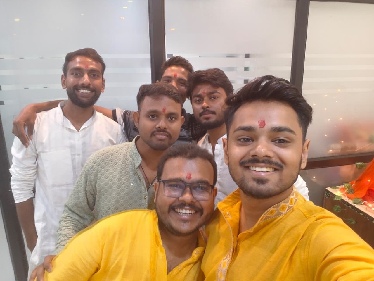 TradeAura team in festive kurtas taking a group selfie on Ganesh Chaturthi