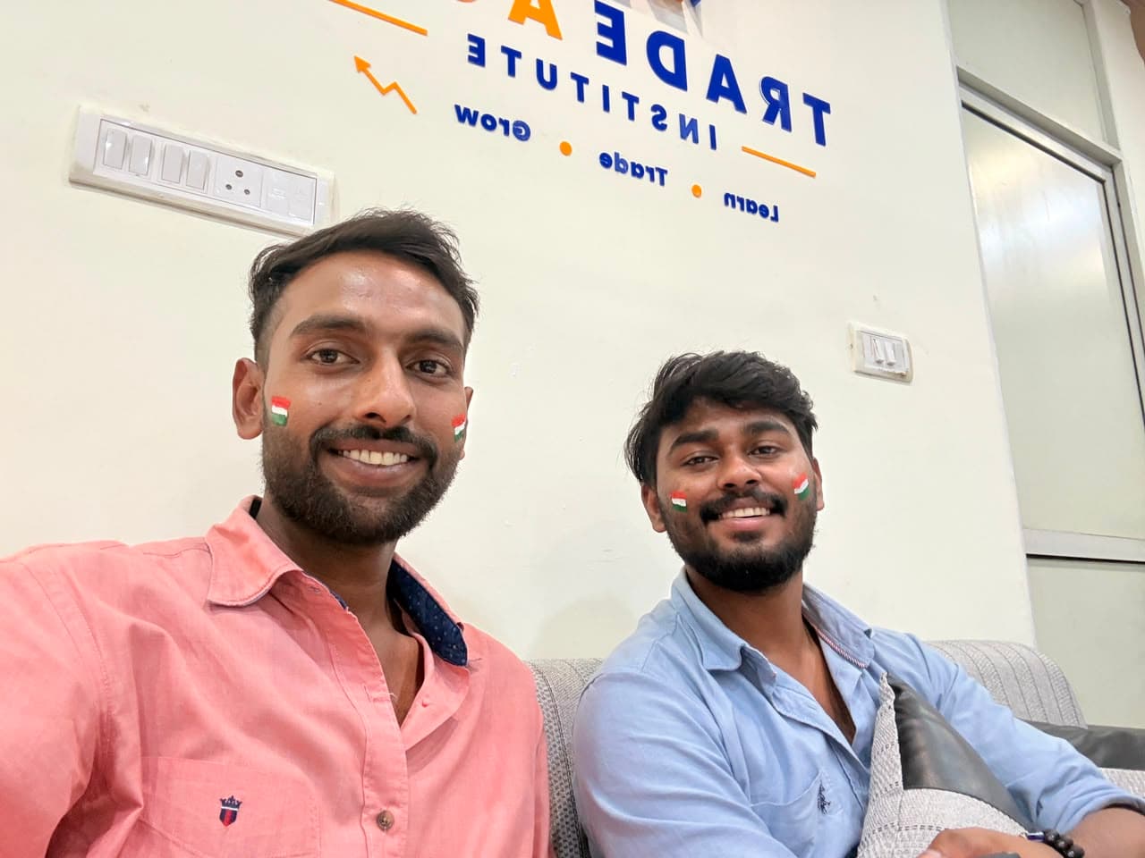 Students and mentors at TradeAura Institute posing with the Indian flag on Independence Day